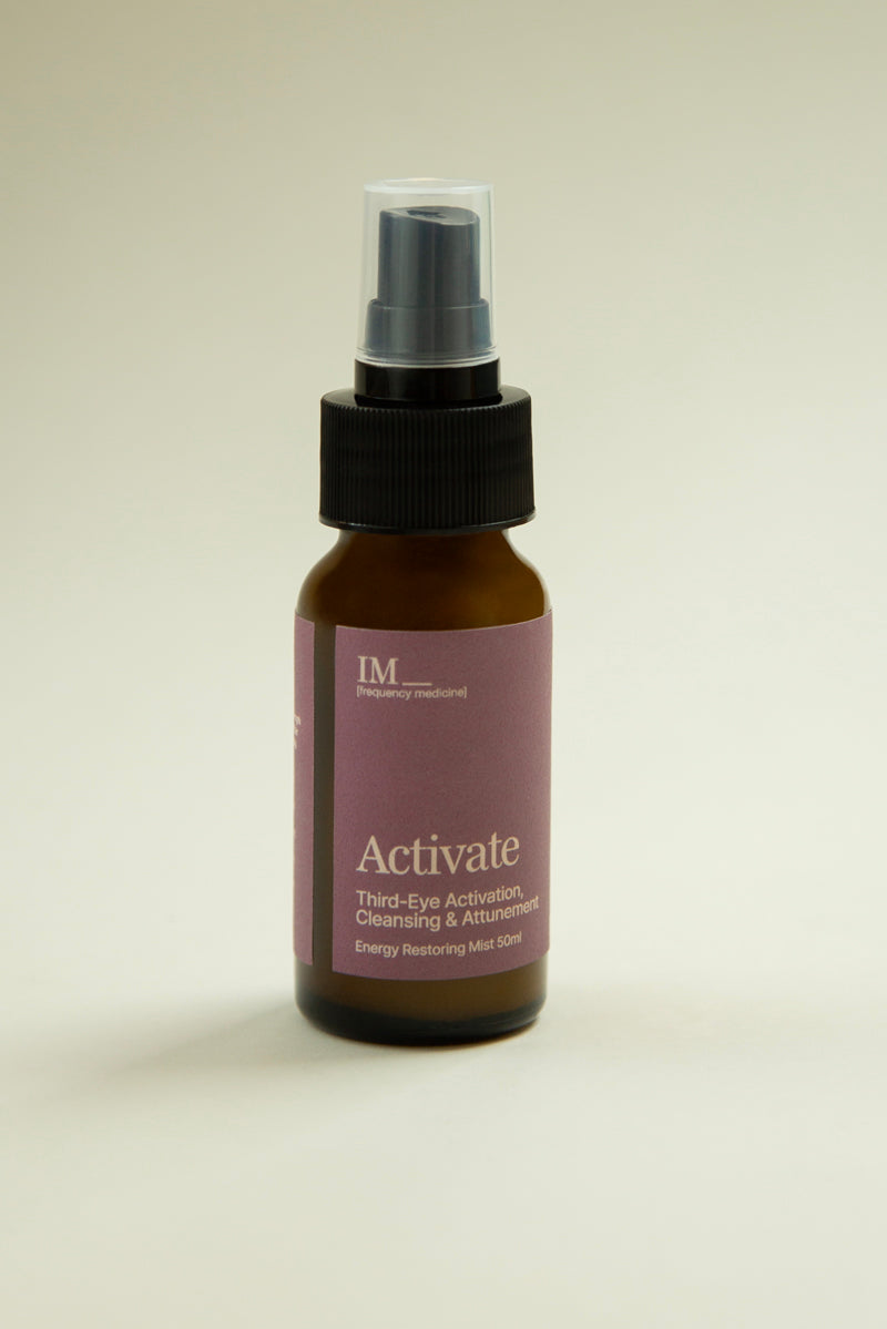 IM_Frequency_Medicine_Activate_mist_spray amber bottle with purple label. Third eye chakra cleansing spray