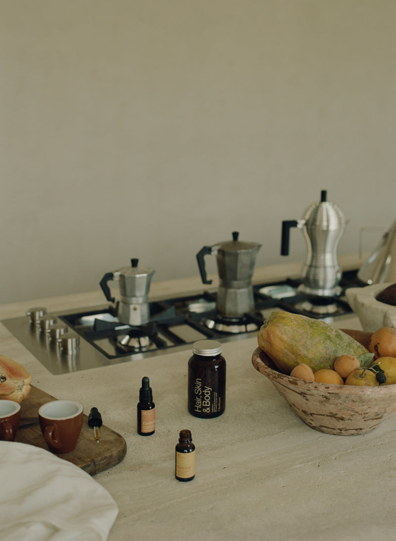 IM Frequency Medicine Inspire and Embody and Glasshouse Hair Skin and Body in Kitchen with coffee pots and fruit. Nutritional therapy