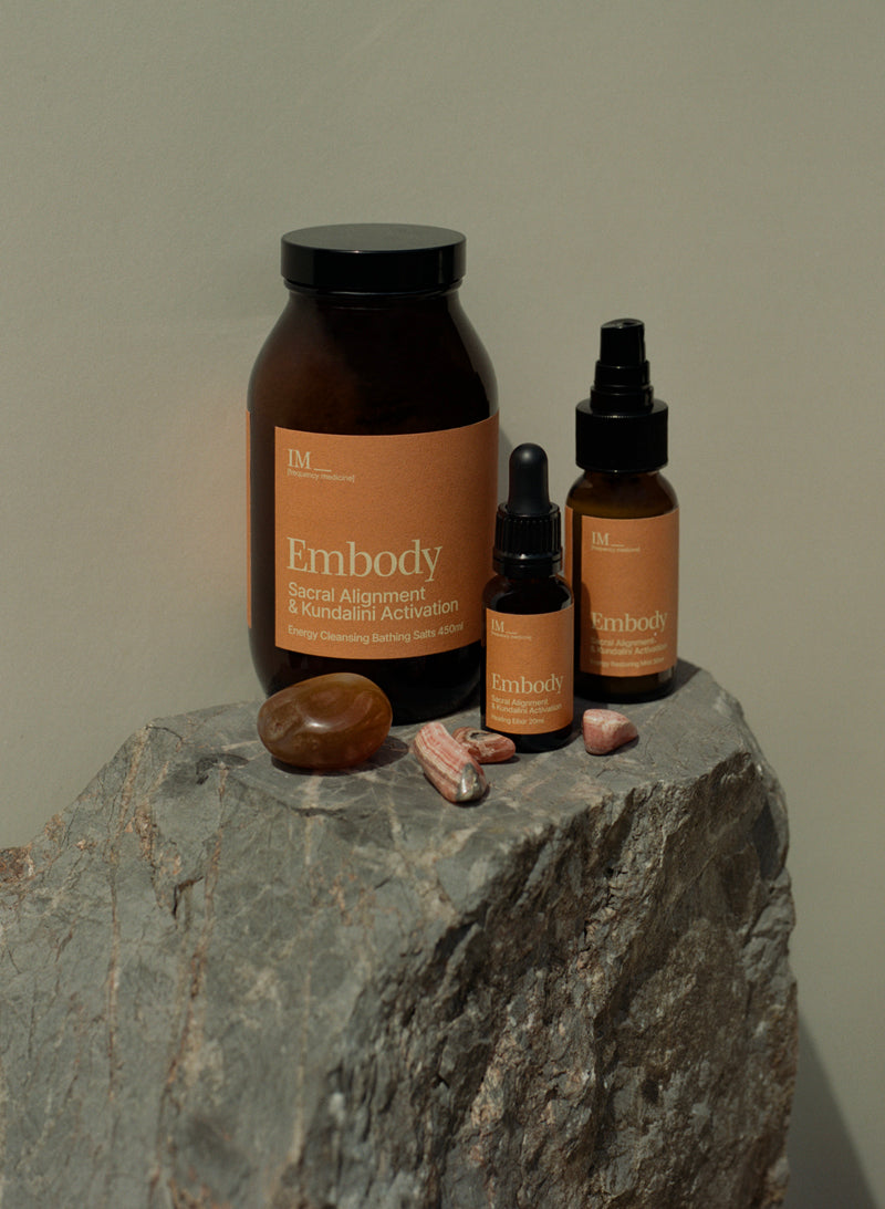IM Frequency Medicine Embody Chakra healing family Sacral baths salts, crystals, energy spray bottles with crystals on a stone